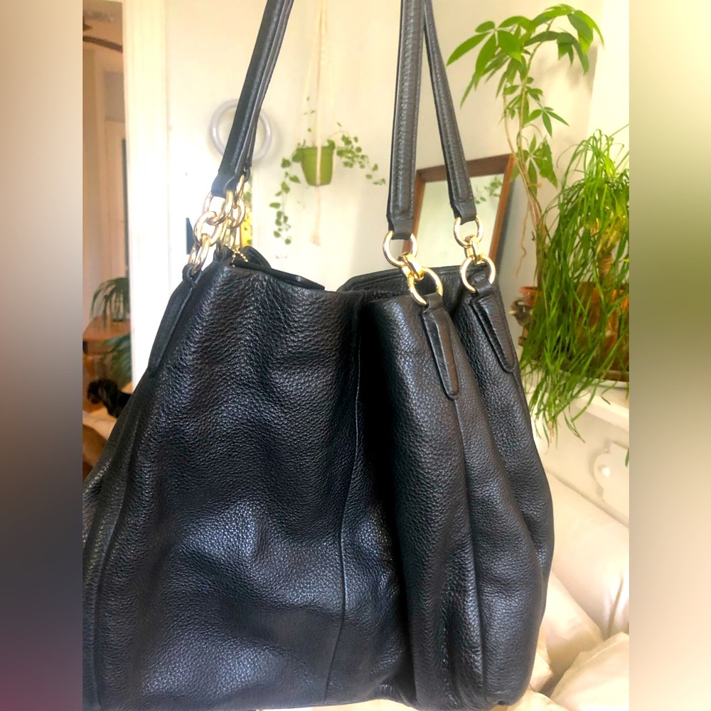 NWOT Coach purse in solid black with black chain and unique zipper opening